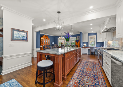 View across kitchen island toward dining room